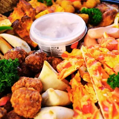 Savoury platter with samosas, meatballs and sausages